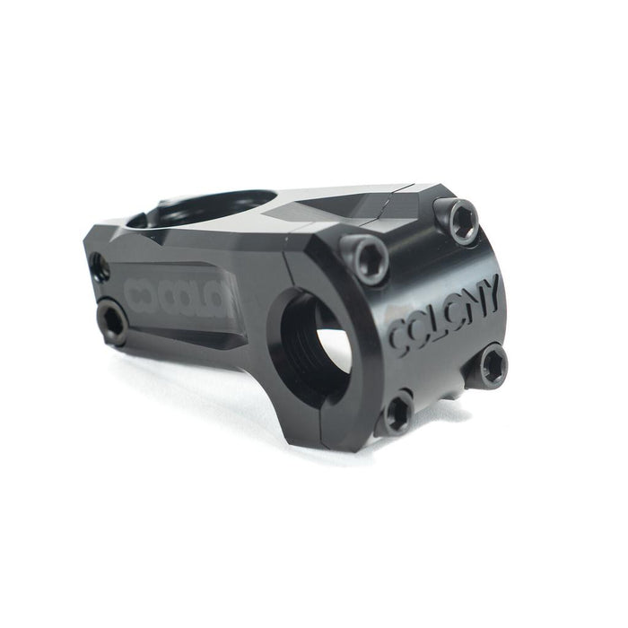 The Colony Official Front Load Stem (22.2mm Clamp) is a black metal stem with four front bolts and “COLONY” engraved on the CNC-machined 7075T6 alloy faceplate, shown photographed on a white background.