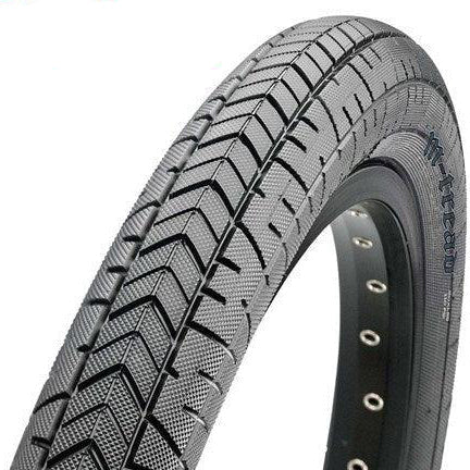 Close-up of the Maxxis M-Tread 20 Inch Tyre in black, featuring a textured tread pattern and visible holes along the metal rim, designed for street and ramp riders, set against a white background.