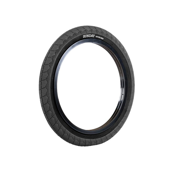 A Sunday Current V2 20 Inch Tyre (Each) in black, featuring a visible tread pattern and the “SUNDAY” logo on the side, displayed against a plain white background. This grippy tire offers reliable performance, making it an excellent choice for beginner riders.